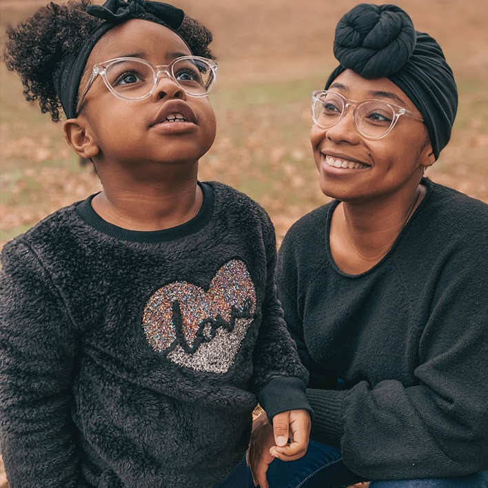 A mother and daughter wearing glasses